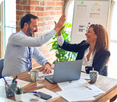 Two people giving each other a high five